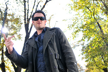 Image showing happy young casual man outdoor portrait posing