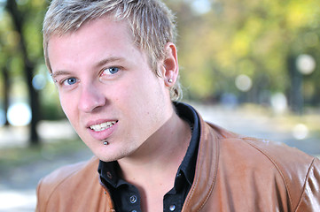 Image showing happy young casual man outdoor portrait smiling