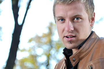 Image showing happy young casual man outdoor portrait posing