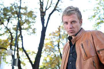 Image showing happy young casual man outdoor portrait posing