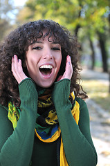 Image showing Young curly woman screeming 