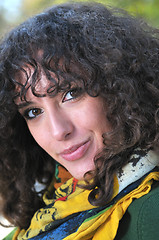 Image showing Young curly woman looking 