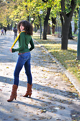 Image showing brunette Cute young woman  posing outdoors