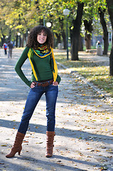 Image showing brunette Cute young woman  posing outdoors