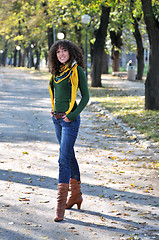 Image showing brunette Cute young woman  posing outdoors