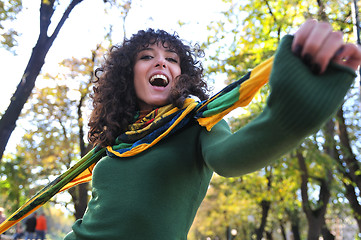 Image showing brunette Cute young woman  posing outdoors