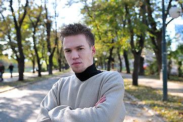 Image showing happy young casual man outdoor portrait posing