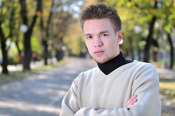 Image showing happy young casual man outdoor portrait posing