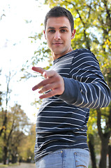 Image showing happy young casual man outdoor portrait posing