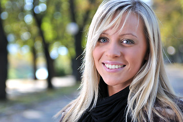 Image showing blonde Cute young woman smiling outdoors