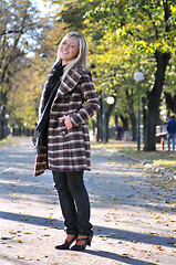 Image showing blonde Cute young woman smiling outdoors