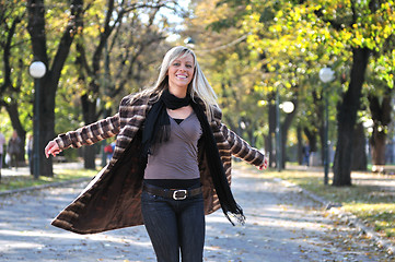 Image showing blonde Cute young woman smiling outdoors