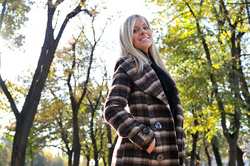 Image showing blonde Cute young woman smiling outdoors