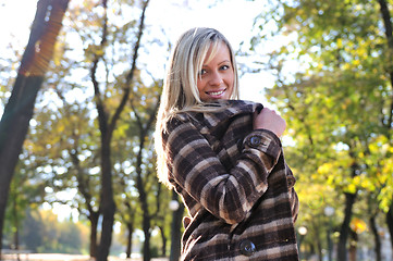 Image showing blonde Cute young woman smiling outdoors