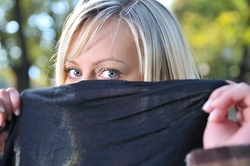 Image showing Young woman hiding her face