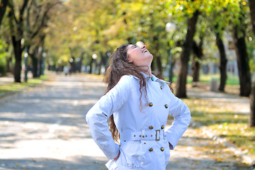 Image showing brunette Cute young woman smiling outdoors in nature