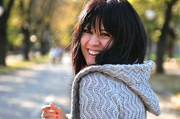 Image showing brunette Cute young woman smiling outdoors