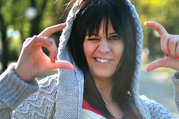 Image showing brunette Cute young woman  posing outdoors