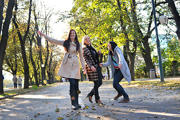 Image showing Happy three friends  outdoors