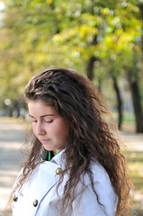 Image showing brunette Cute young woman posing outdoors