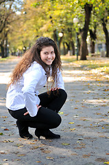 Image showing brunette Cute young woman smiling outdoors in nature