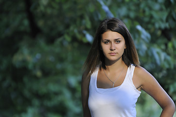 Image showing brunette Cute young woman smiling outdoors in nature