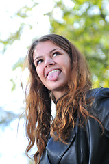 Image showing brunette Cute young woman smiling outdoors in nature