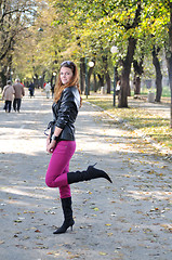 Image showing brunette Cute young woman posing outdoors