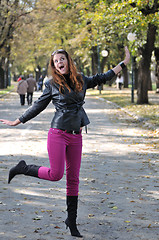 Image showing Young woman jumping in nature