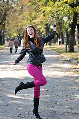 Image showing brunette Cute young woman smiling outdoors in nature