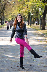 Image showing brunette Cute young woman smiling outdoors in nature