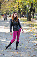 Image showing brunette Cute young woman posing outdoors