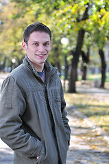 Image showing happy young casual man outdoor portrait smiling