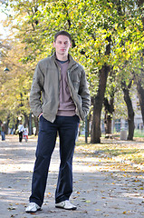 Image showing happy young casual man outdoor portrait posing