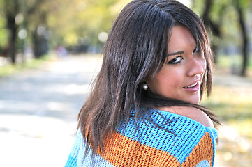 Image showing brunette Cute young woman posing outdoors