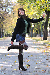 Image showing brunette Cute young woman smiling outdoors in nature