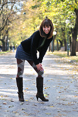 Image showing brunette Cute young woman smiling outdoors in nature