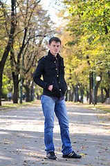 Image showing happy young casual man outdoor portrait posing