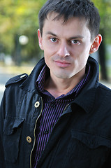 Image showing happy young casual man outdoor portrait posing