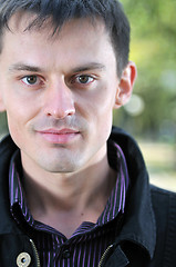 Image showing happy young casual man outdoor portrait posing