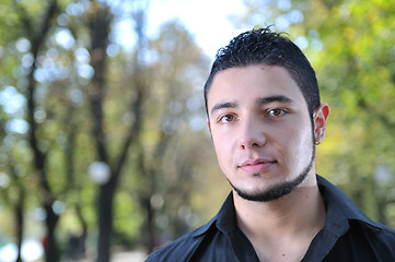 Image showing happy young casual man outdoor portrait posing