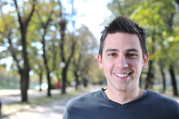 Image showing Handsome young man smiling outdoors