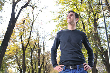 Image showing Handsome young man smiling outdoors