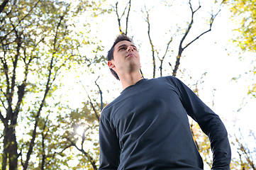 Image showing happy young casual man outdoor portrait posing