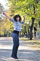 Image showing brunette Cute young woman  dancing outdoors