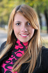 Image showing brunette Cute young woman smiling outdoors