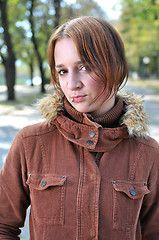 Image showing brunette Cute young woman with piercing posing outdoors