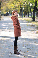 Image showing brunette Cute young woman with piercing posing outdoors