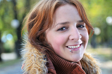 Image showing brunette Cute young woman smiling outdoors