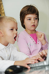 Image showing childrens have fun and playing games on laptop computer